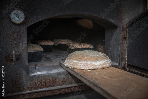 Bread in a traditional way, homemade, bake bread in wooden oven