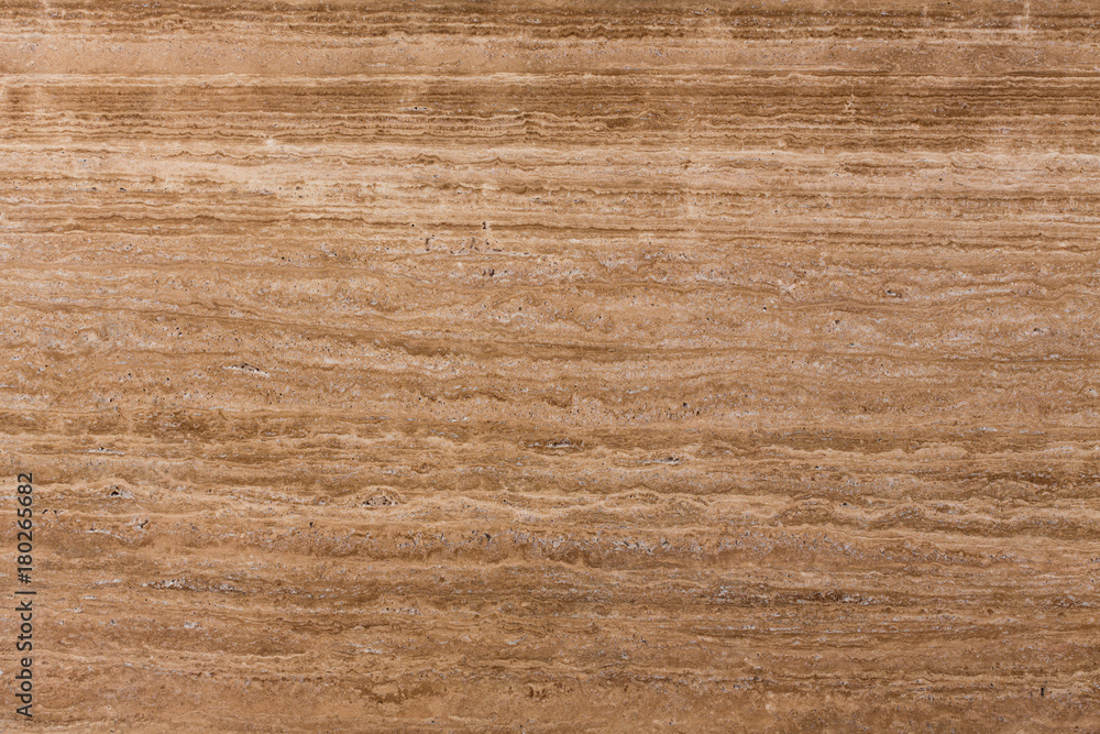 Fototapeta premium Travertine gold. Pattern of natural origin on the surface of the stone, close-up.