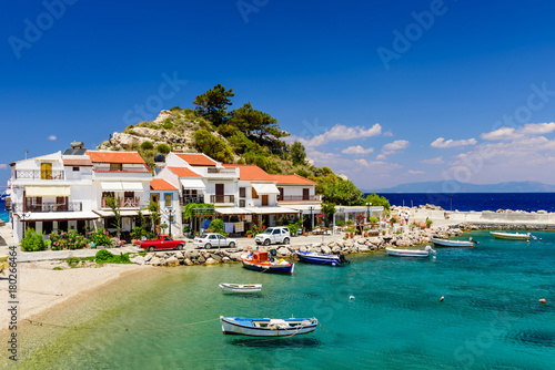 The picturesque village of Kokkari with traditional houses and fishing boats. Kokkari village is a popular tourist place on the island of Samos.