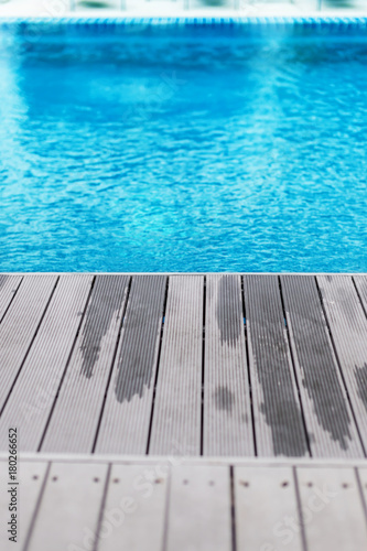 wooden deck with swimming pool side
