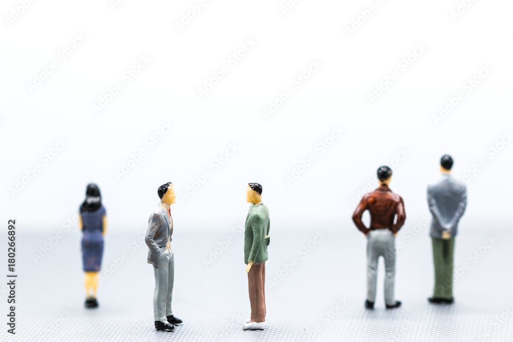 Miniature people : small figures businessmen stand on white Background with copy space and using as background finance business team competition concept, business plan concept,Stock Exchange concept. Miniature people : small figures businessmen stand on white Background with copy space and using as background finance business team competition concept, business plan concept,Stock Exchange concept.