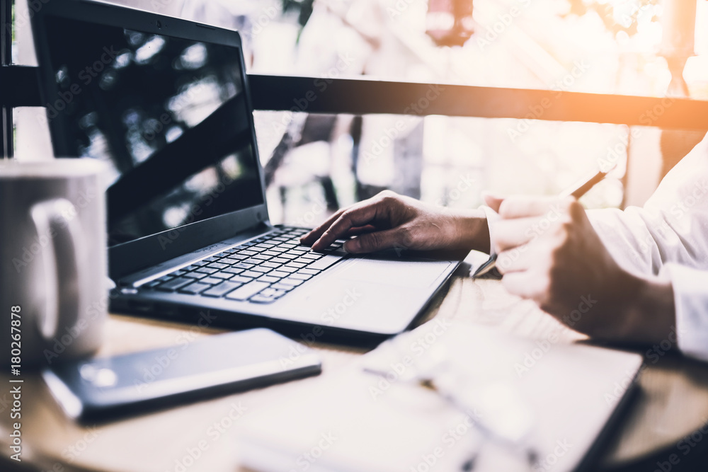 business concept with business woman working with business graph and laptop and smartphone on woooden table top business concept with business woman working with business graph and laptop and smartphone on woooden table top