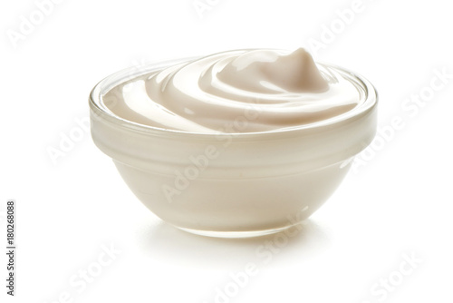 Bowl of sour cream, isolated on white background. photo