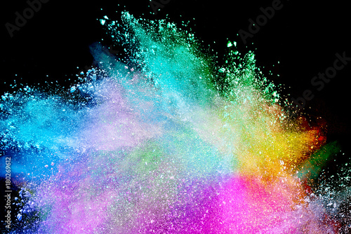 Splash of colorful powder over black background.