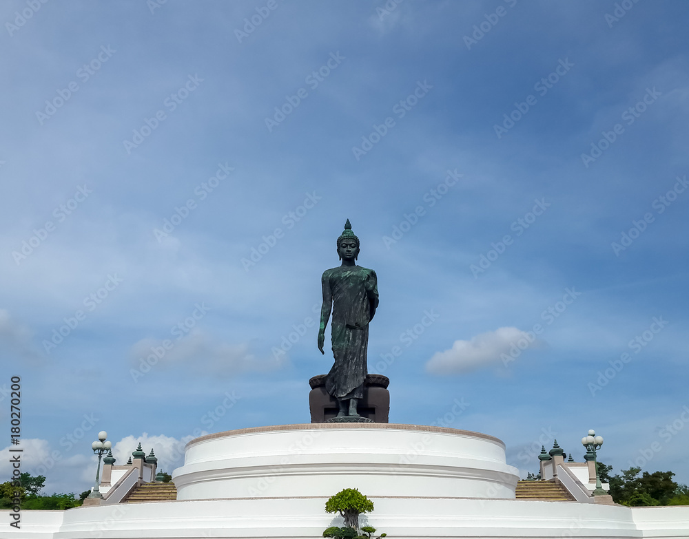 large walking buddha statue in Thailand