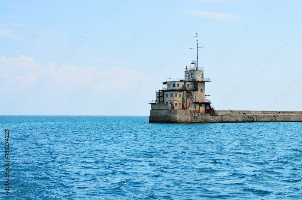 In the sea stands a lighthouse. In the sea stands a lighthouse.