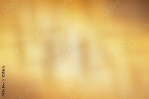 abstract yellow background with stripes and light and dark spots