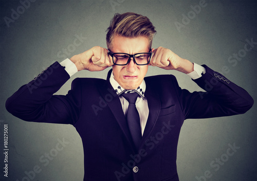Photos Closeup of a crying man in glasses