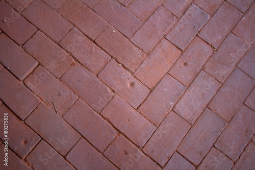 Old floor in an ancient castle arranged from red bricks