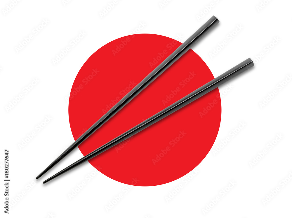 Black Wooden chopsticks on Japanese Flag. Asian Food concept. Black Wooden chopsticks on Japanese Flag. Asian Food concept.