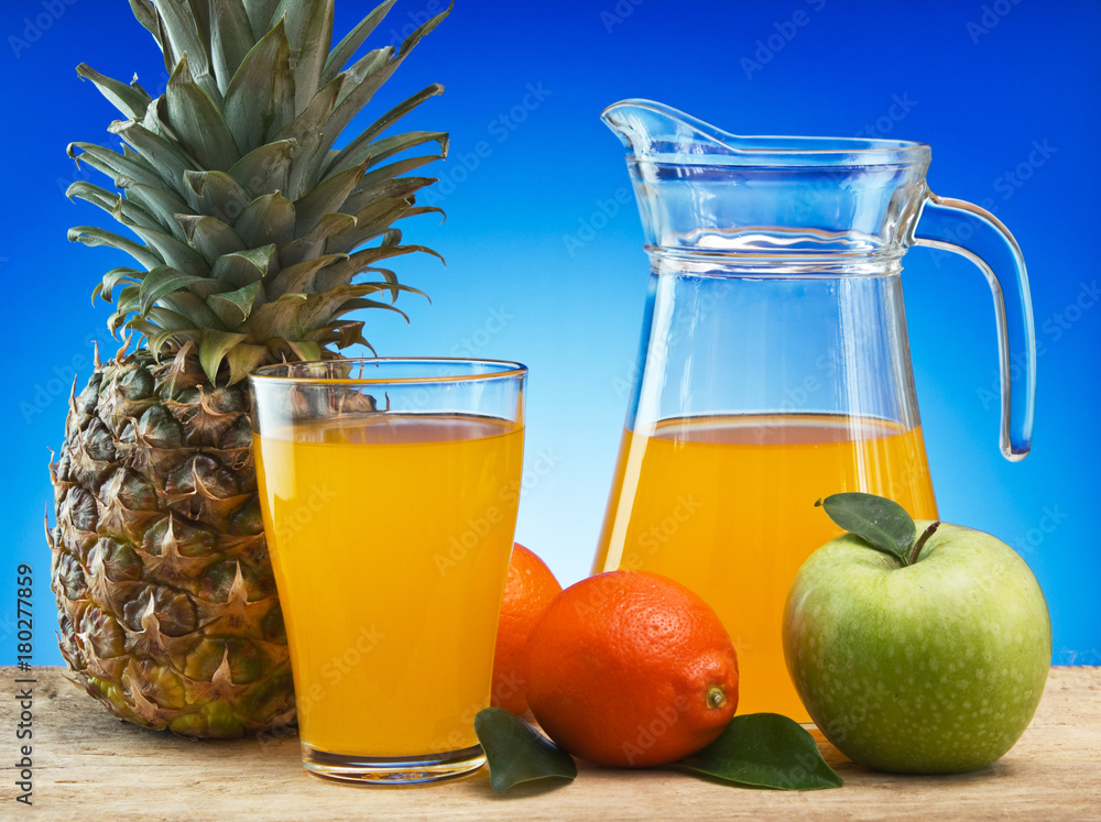 Fruit and juice on a wooden table Fruit and juice on a wooden table