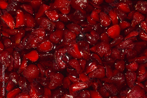 Background of fresh red cutted strawberry fruits