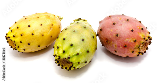 Three whole prickly pears, orange, green and yellow isolated on white background.
