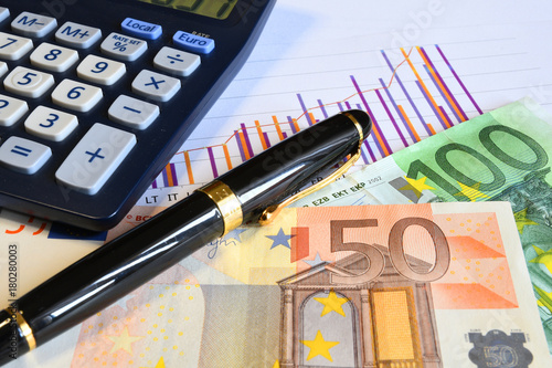 Photos Euro money with calculator, pen and paperwork