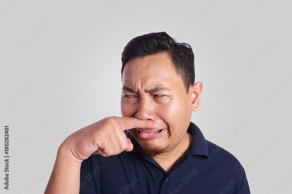 Asian Man Close His Nose Sick of Bad Smell Asian Man Close His Nose Sick of Bad Smell