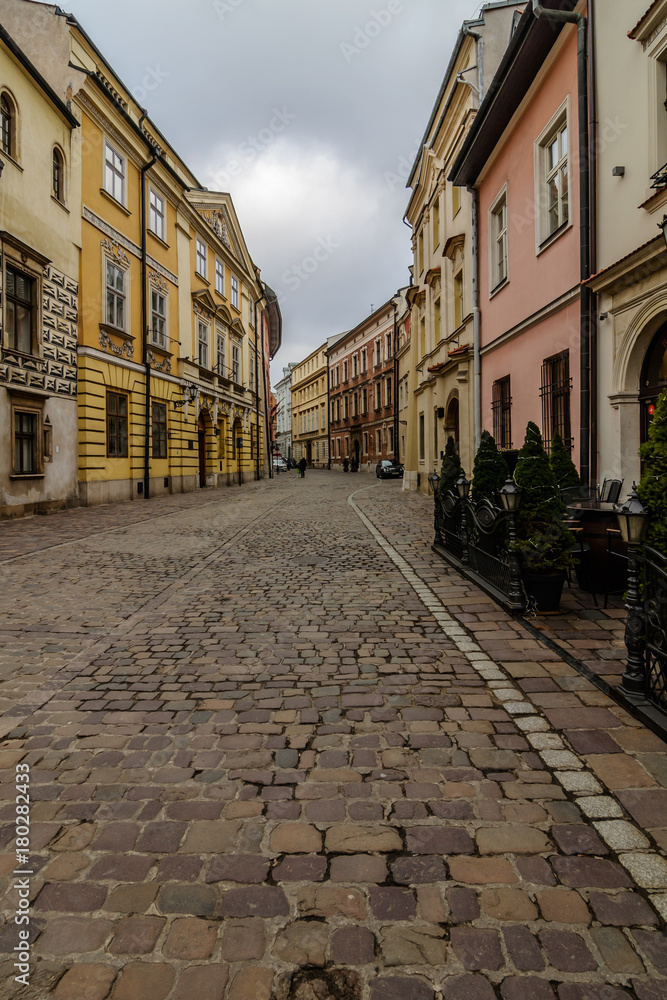 An ancient street with a stone pavement on a cloudy day