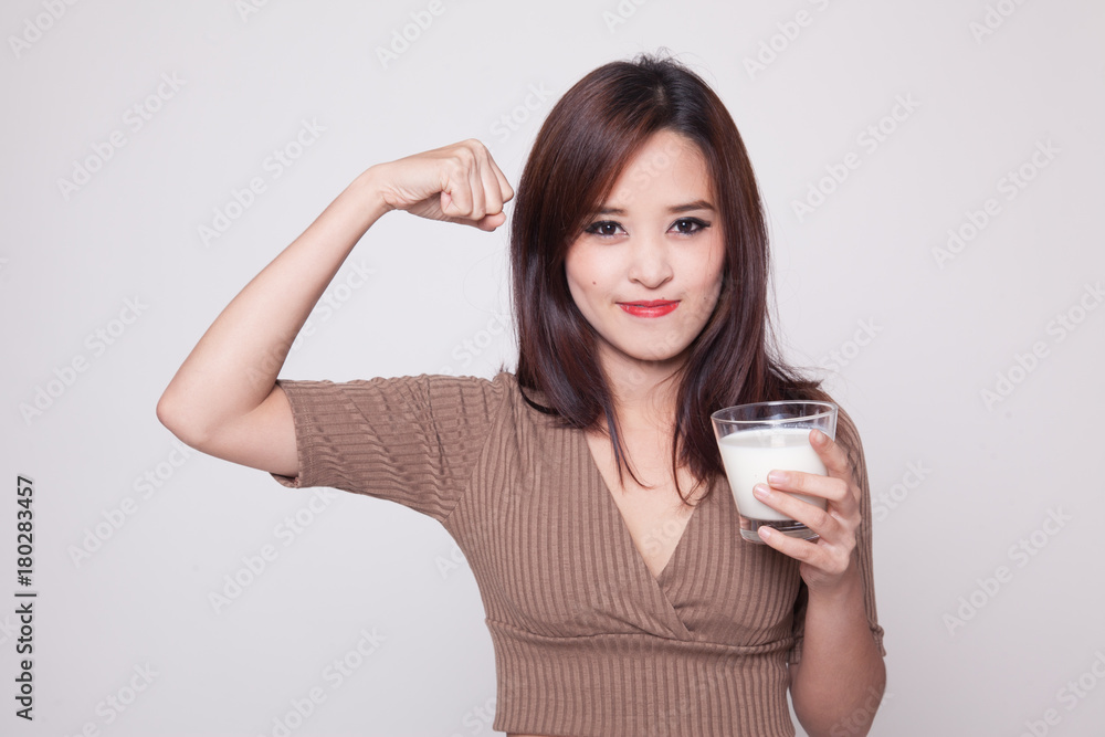 Healthy Asian woman drinking a glass of milk. Healthy Asian woman drinking a glass of milk.