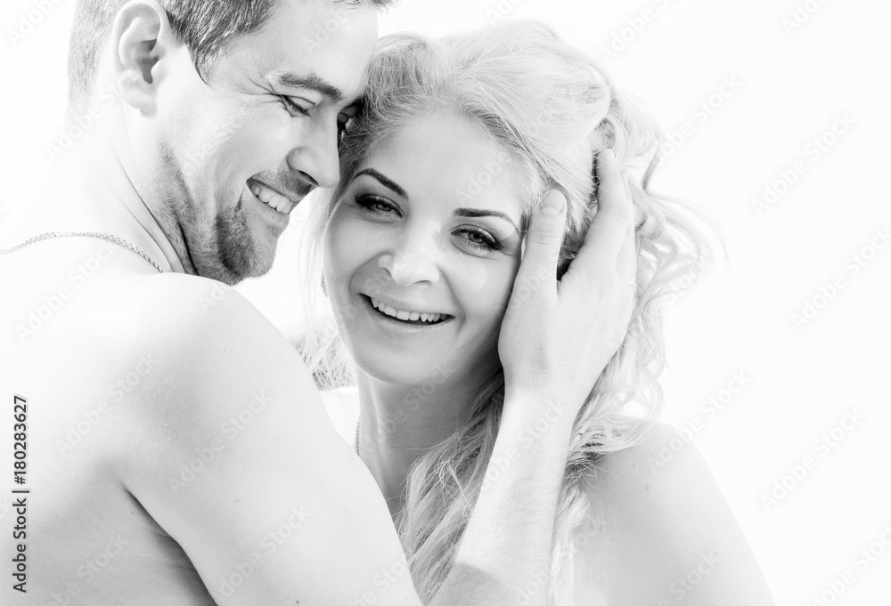 Fototapeta premium Beautiful couple in love embraces, nude