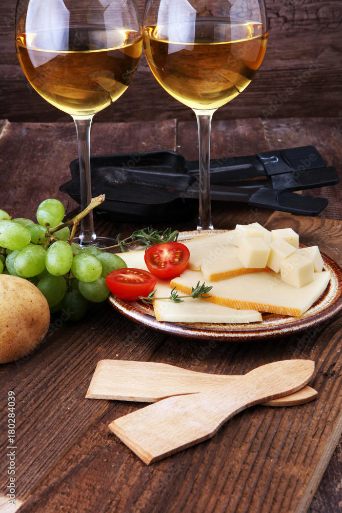 Delicious traditional Swiss melted raclette cheese on diced boiled or baked potato served in individual skillets. Delicious traditional Swiss melted raclette cheese on diced boiled or baked potato served in individual skillets.