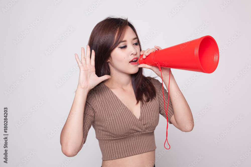 Beautiful young Asian woman announce with megaphone. Beautiful young Asian woman announce with megaphone.