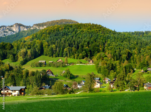 Breathtaking lansdcape of mountains, forests and small Bavarian villages in the distance. Scenic view of Bavarian Alps with majestic mountains in the background.