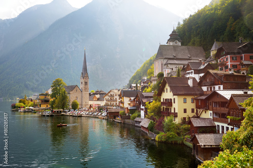 Scenic view of Hallstatt lakeside town in the Austrian Alps in beautiful evening light on beautiful day in autumn.