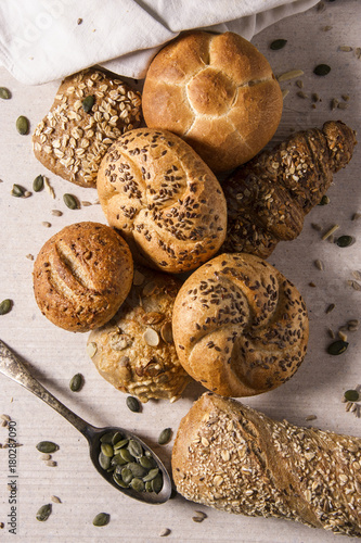 Selection of  Mixed Bread Rolls or Bunson the bright stone Background with different seeds photo