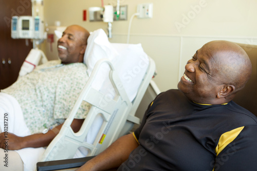 Man having a visitor in the hospital. photo