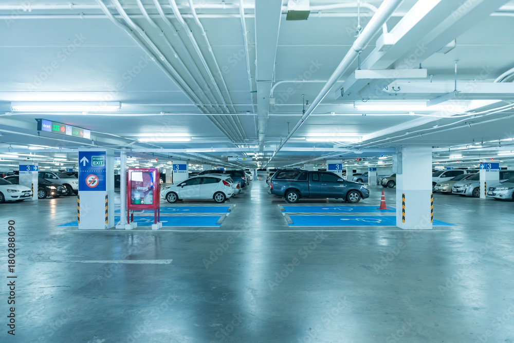 NAKHONRATCHASIMA, THAILAND - JULY 22, 2017 : A lot of cars in garage of department store at night in terminal 21,This place is very famous shopping mall NAKHONRATCHASIMA, THAILAND - JULY 22, 2017 : A lot of cars in garage of department store at night in terminal 21,This place is very famous shopping mall