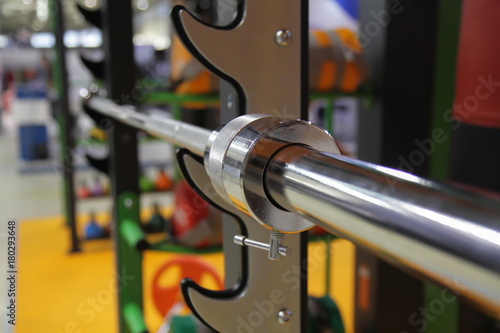 barbells in sport gym on rack close up