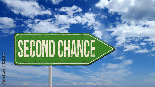 Second chance metallic vintage sign over blue sky with clouds photo