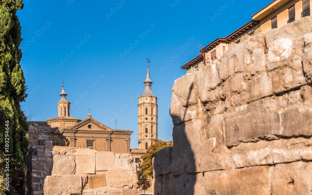 Roman walls in the background of the church Iglesia de San Juan de los Panetes, Zaragoza, Spain. Copy space for text.