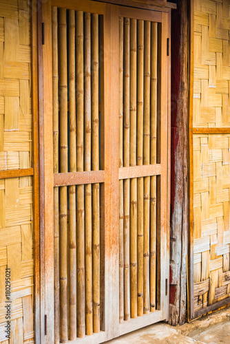 View of the bamboo door in Louangphabang, Laos. Close-up. Vertical.