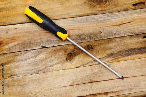 Screwdriver Over Wooden Background