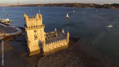 Lisbon, Portugal, aerial view of Belem Tower (Torre de Belem) by the Tagus river at sunset. photo