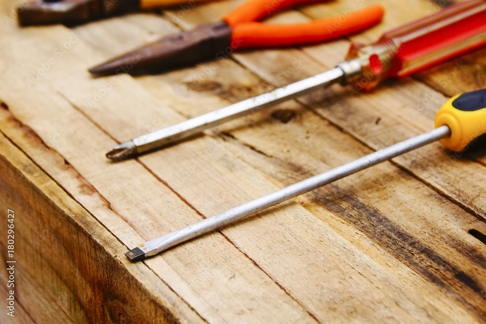Group Of Used Hardware Tools Over Wooden Background Group Of Used Hardware Tools Over Wooden Background