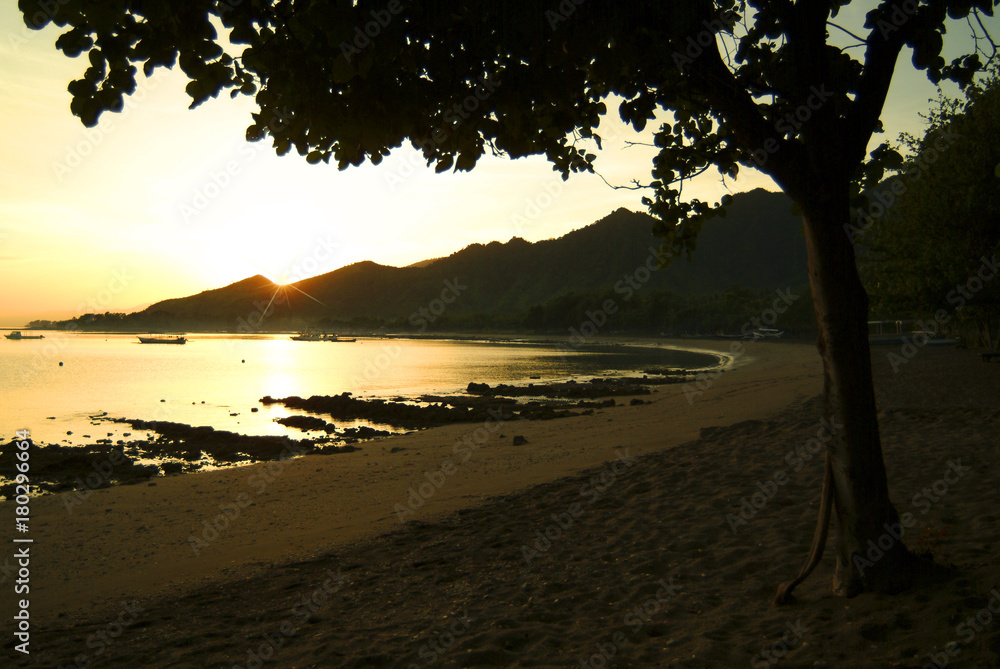 Sunrise On Pemuteran Beach, Bali, Indonesia. In the northwest corner of Bali the village of Pemuteran is the gateway to Bali Barat national park. A diving and tourism destination. 