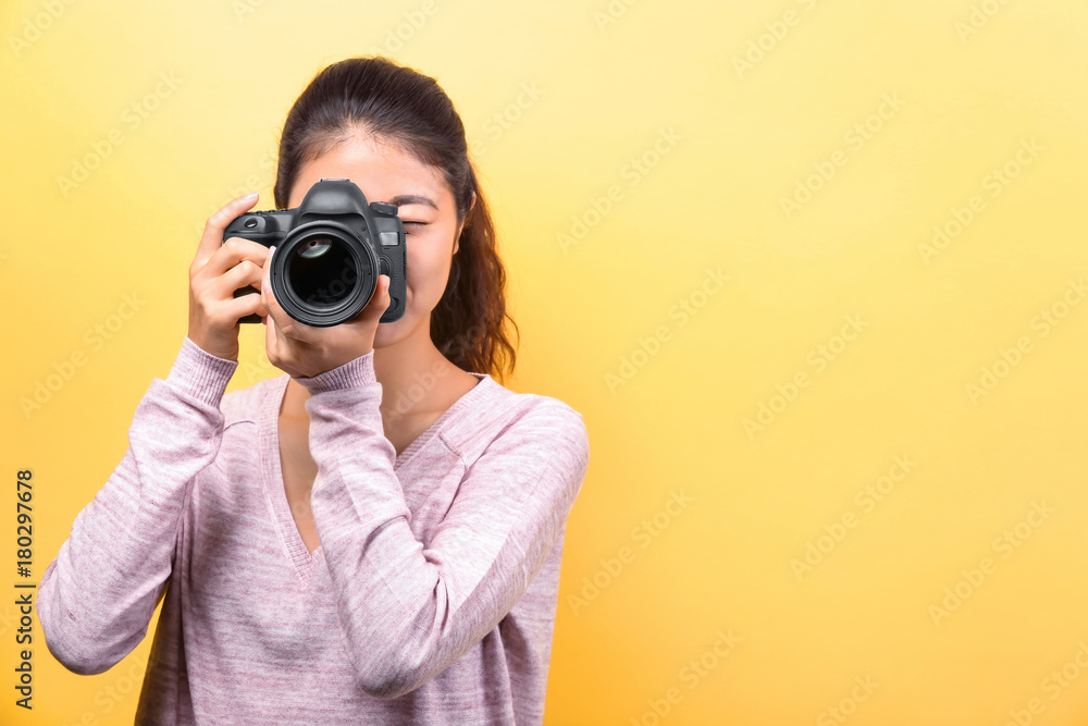 Beautiful young photographer on color background Beautiful young photographer on color background