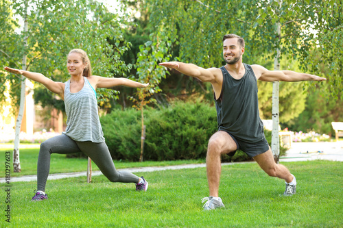 Young man and woman doing e...