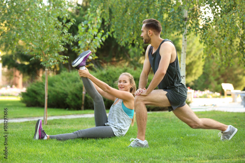 Young man and woman doing e...
