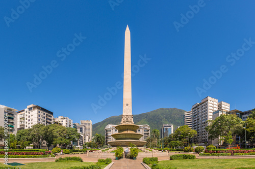 Panoramic view of Altamira's Obelisk on a sunny day with blue skies in Francia Square (A.k.a. Plaza Altamira), in venezuelan capital city Caracas, in 2017. photo