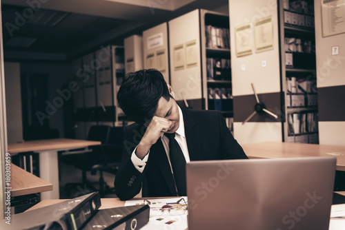 Asian stress business man working fail,The owner of the company blamed him with bad word,Thai employee serious from hard work from boss,Sad handsome guy in black suit