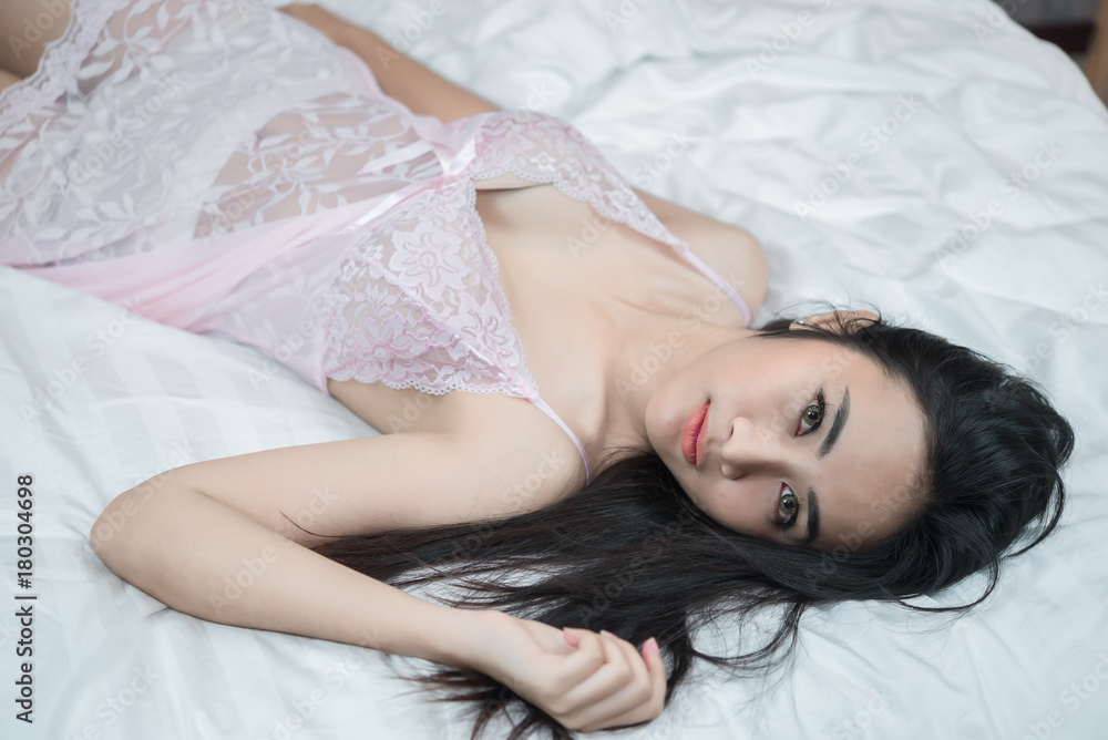 Portrait Asian sexy woman in the bed,Perfect portrait Thailand lady indoors Portrait Asian sexy woman in the bed,Perfect portrait Thailand lady indoors