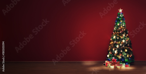 view of nice decorated christmas tree and some gift boxes indoor