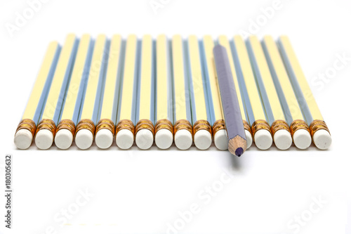 blue pencil on many pencils and white background