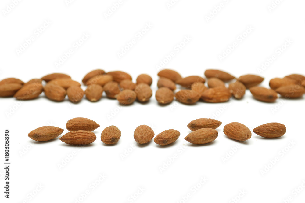 Almond pile lay on white background Almond pile lay on white background