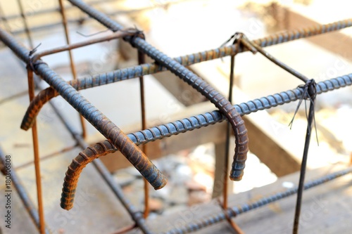 Steel bars for reinforced concrete. Closeup of Steel Bar. Geometric alignment of Re bars on construction site. Rusty is iron rust