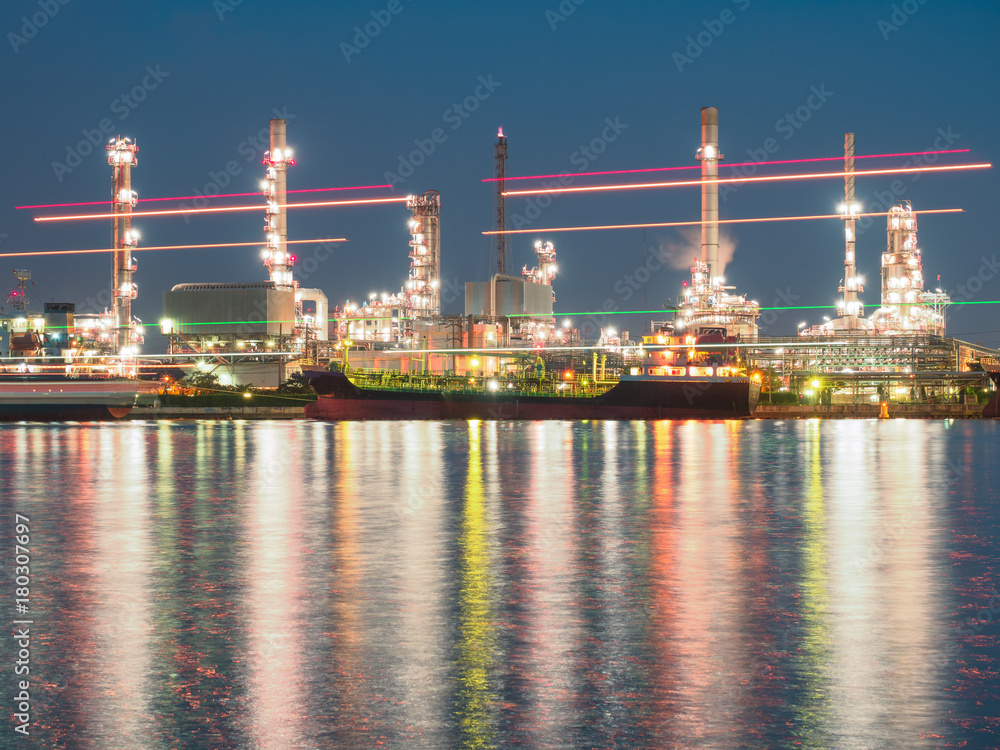 long exposure shot of oil refinery plant against blue evening sky