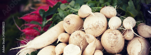 White radishes pile in a market