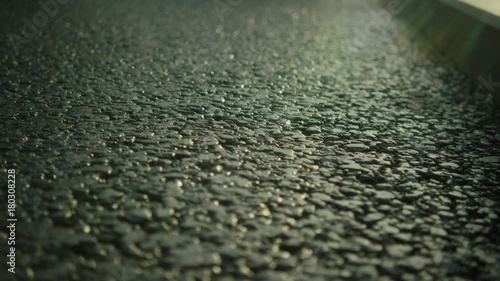 Asphalt road close-up in sunny weather